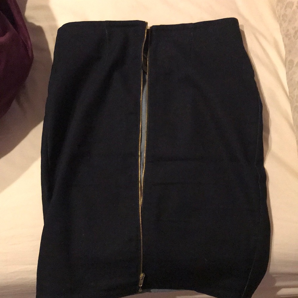 Tight dark jean skirt with gold zipper down front